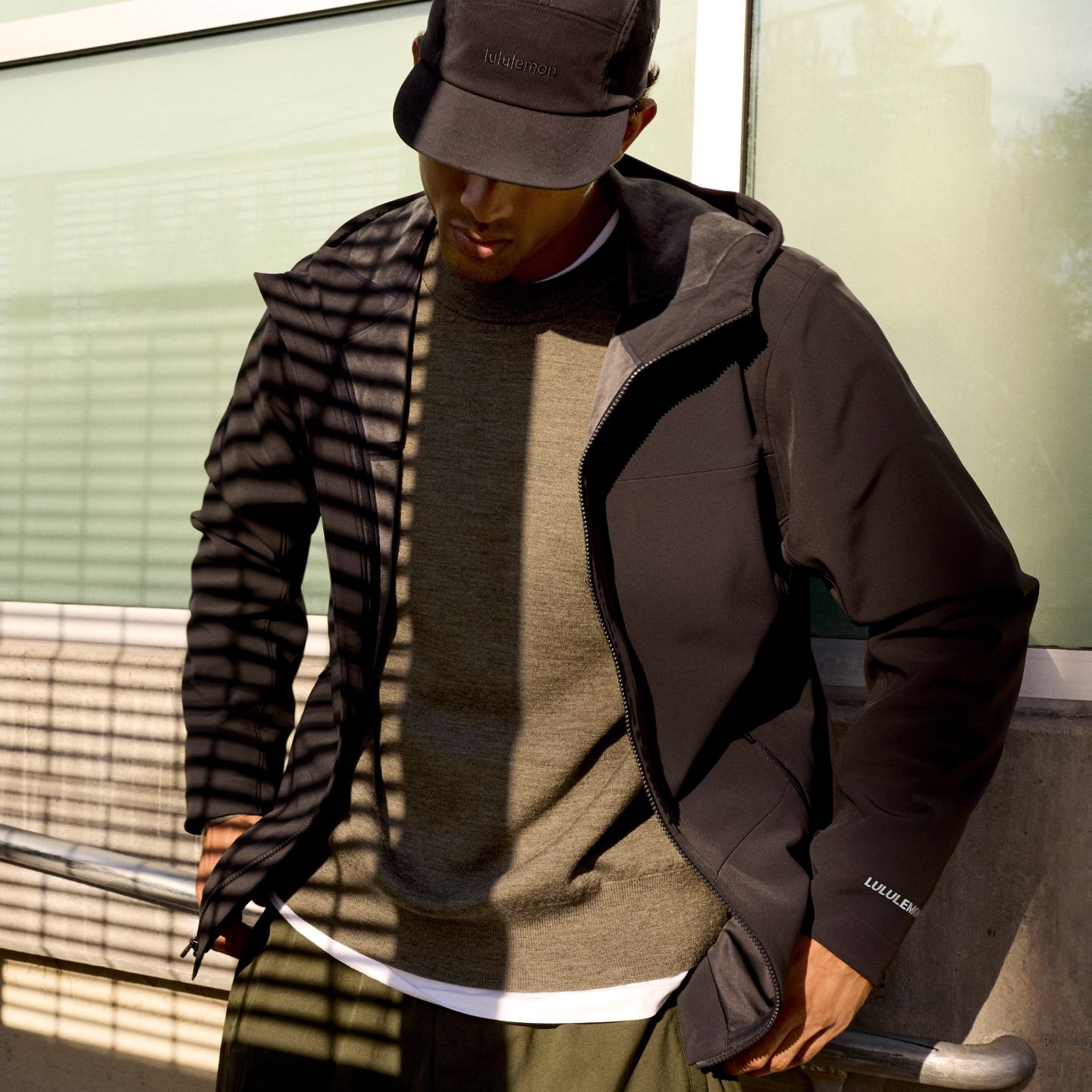 A person wears the lululemon Cross Chill City-to-Trail Jacket.