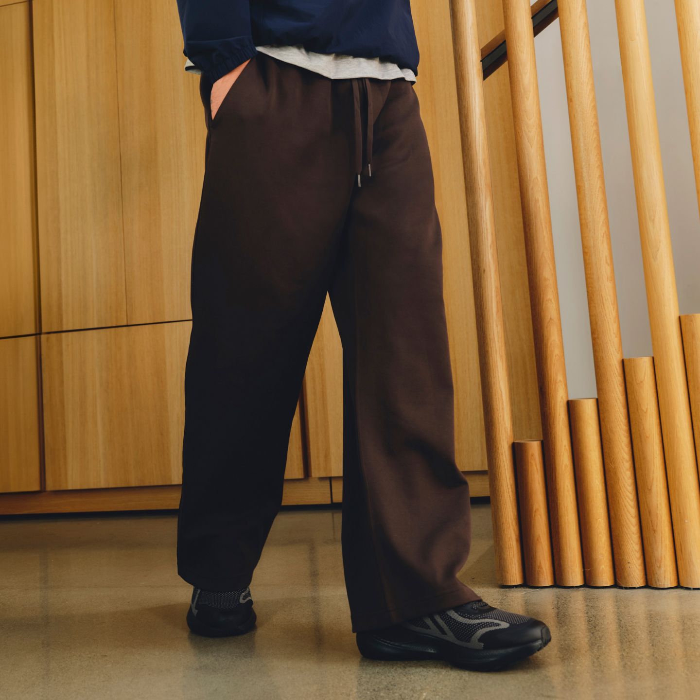 A person wears Grand Standard Sweatpants.