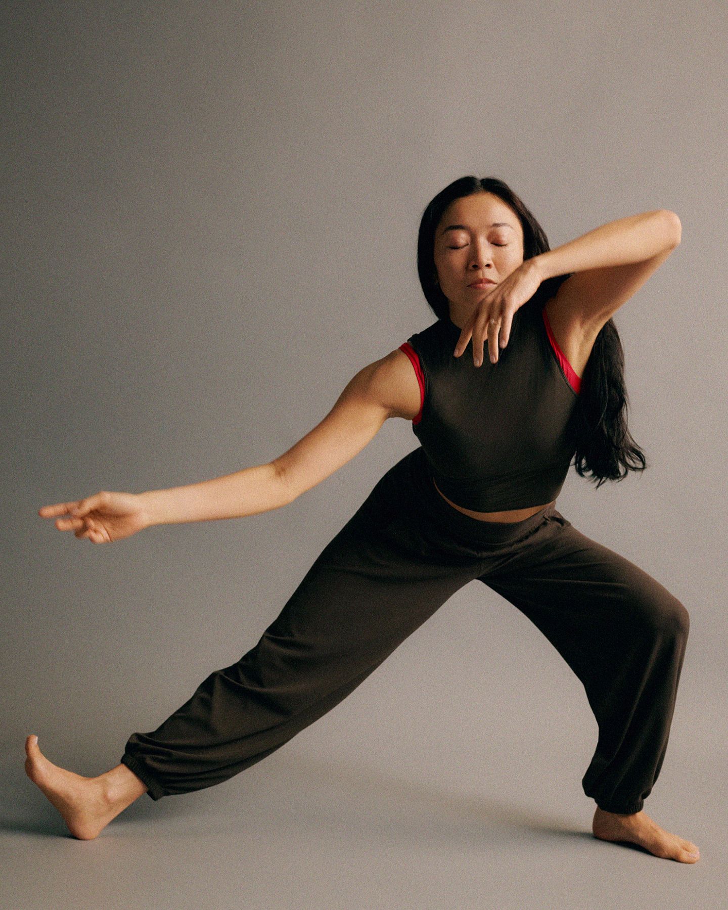 A person practices yoga while wearing the Align Foldover Relaxed Jogger.
