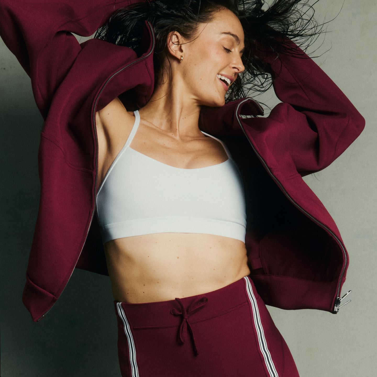 Megan Roup wears a Smooth Spacer hoodie, Flow Y bra, and Groove shorts from the Megan Roup Edit.