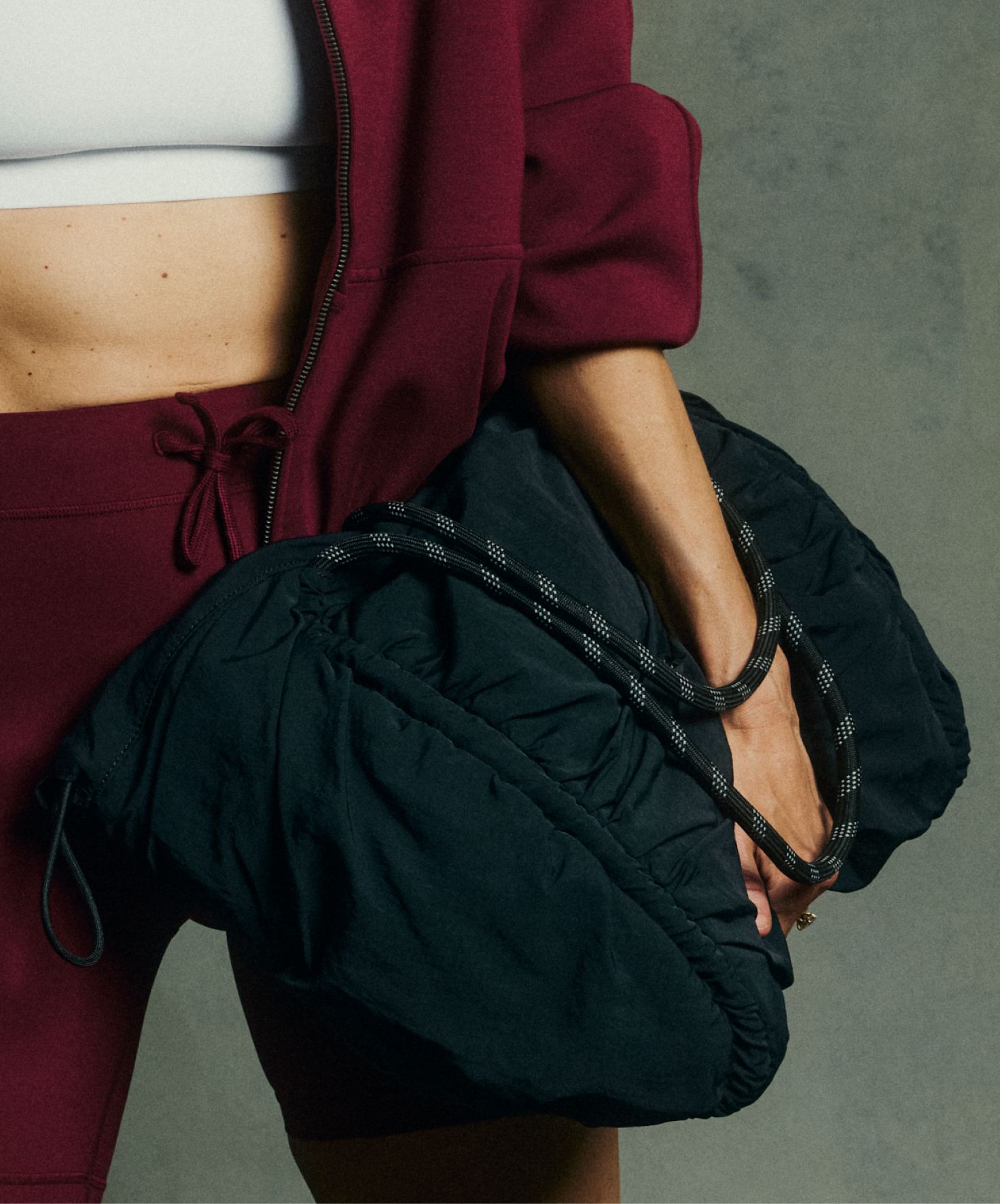 Megan Roup holds a bag from the Megan Roup Edit. 