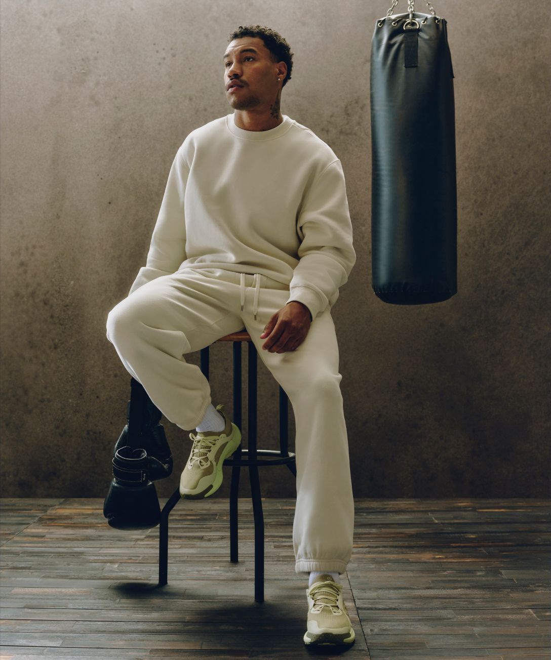 A person wears a new Steady State SuperLoft™ set for post-workout recovery.