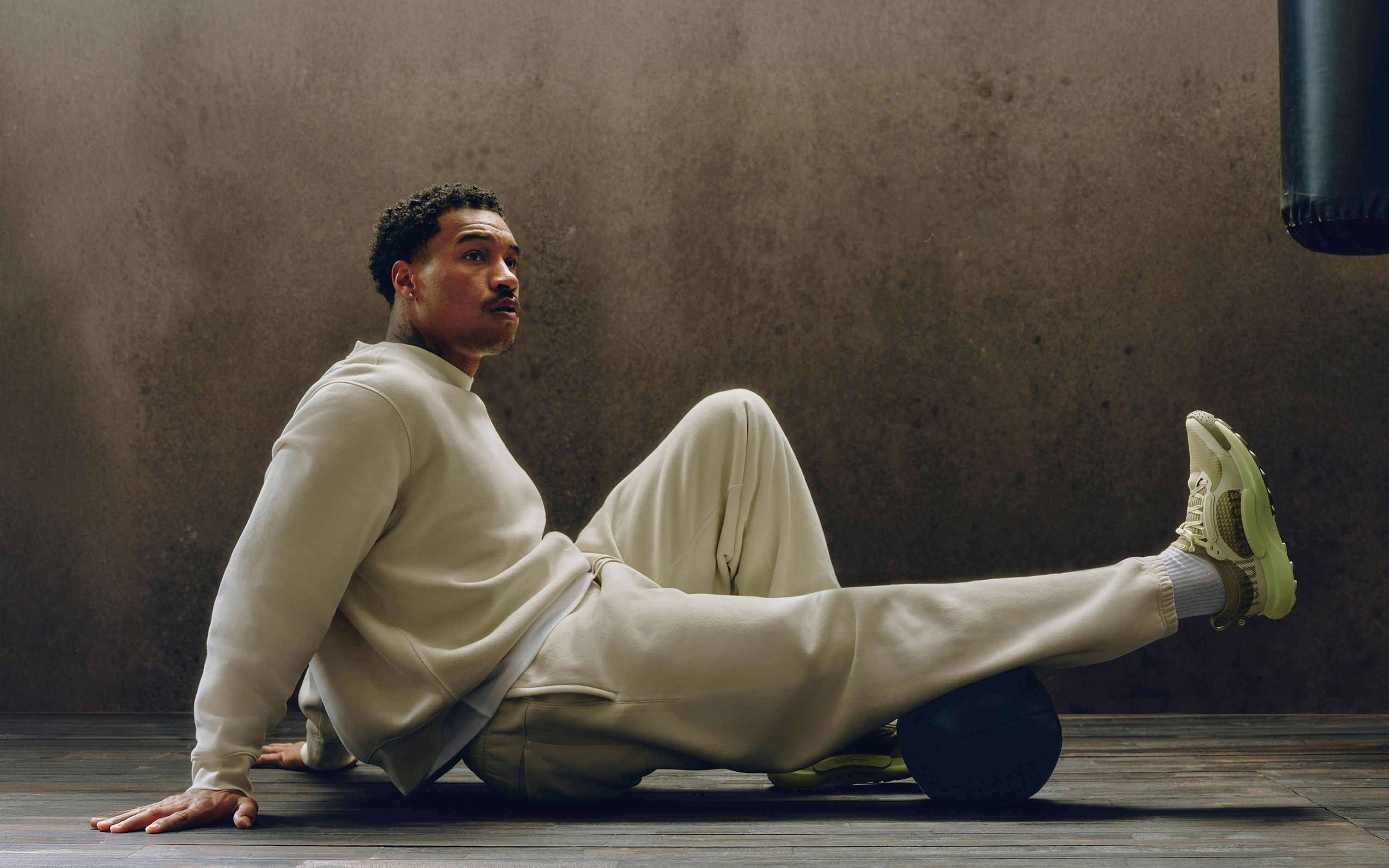 A person wears a new Steady State SuperLoft™ set for post-workout recovery.