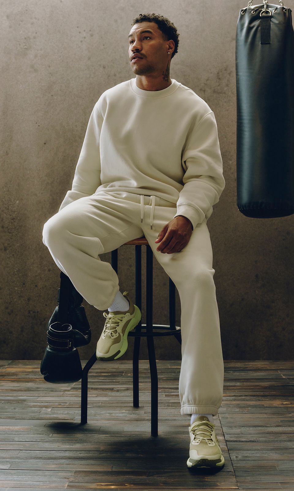 A person wears a new Steady State SuperLoft™ set for post-workout recovery.