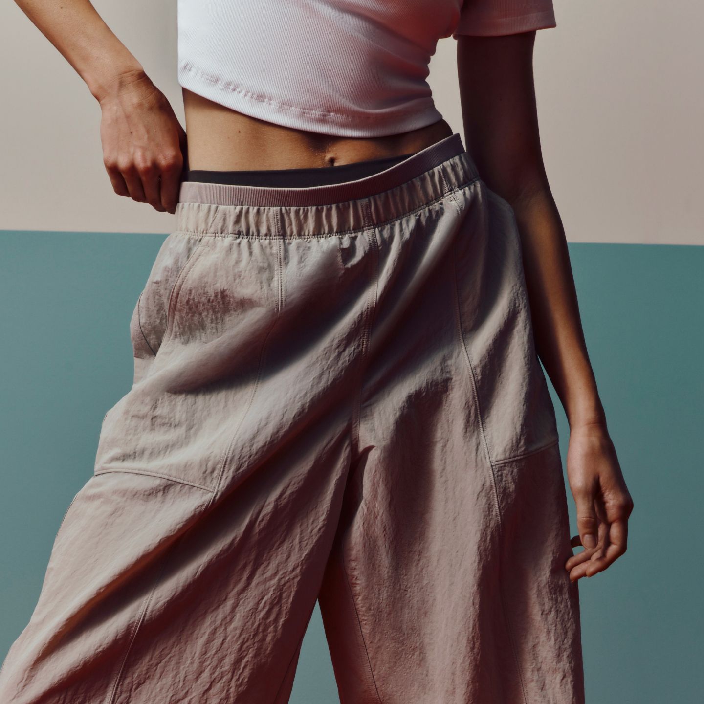 A person wears the lululemon Crinkle Nylon Barrel-Leg Pant.