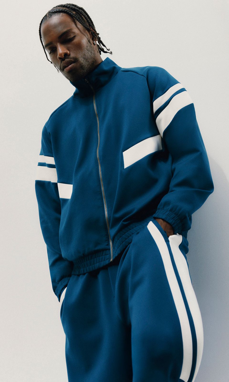 A person wears the Spacer Tracksuit.