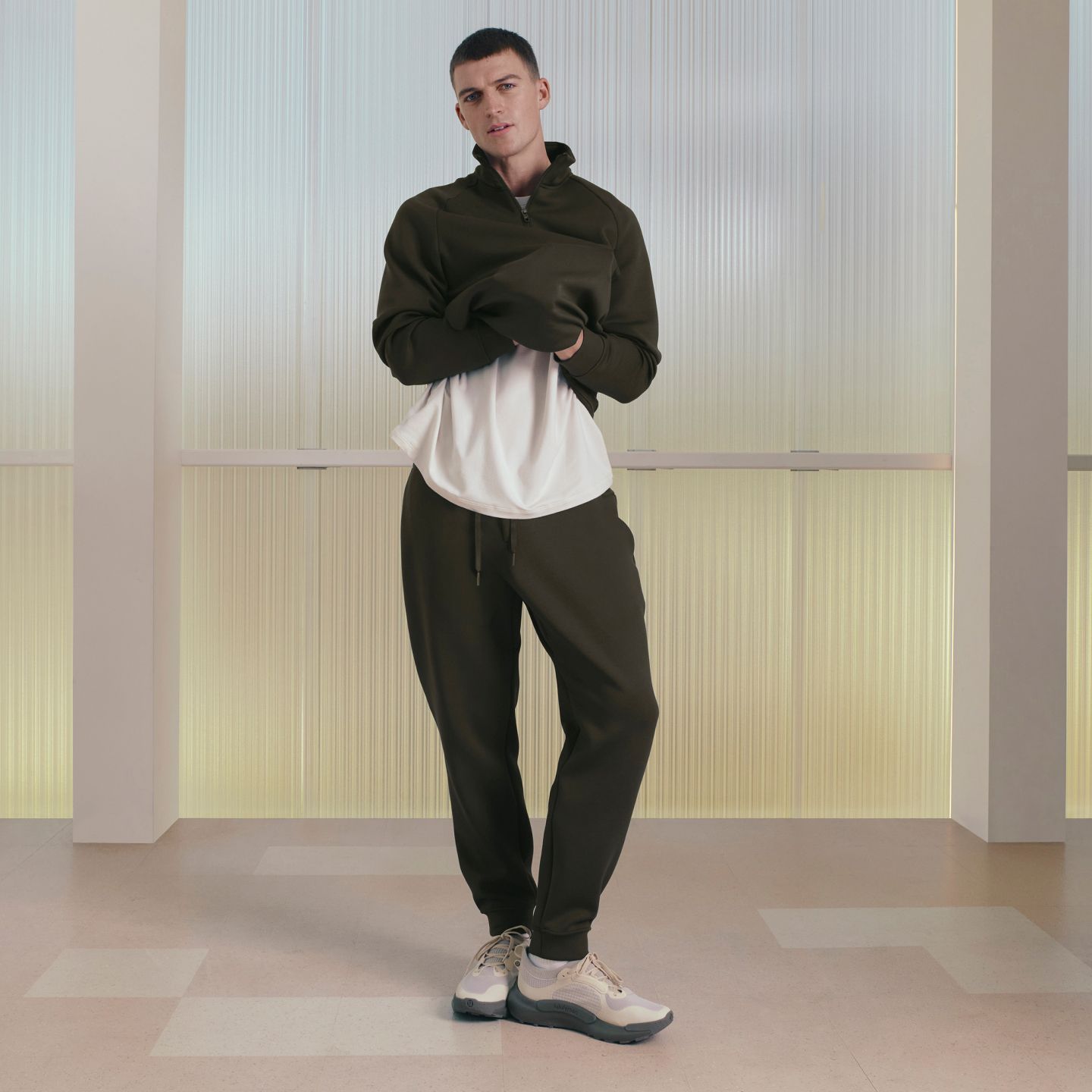 A person stands while wearing the Smooth Spacer Jogger.