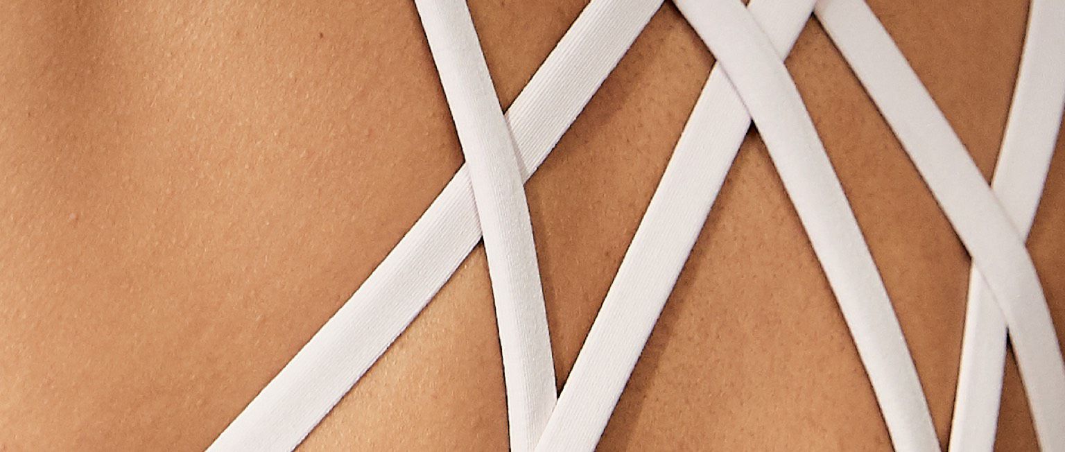 Back of white strappy sports bra