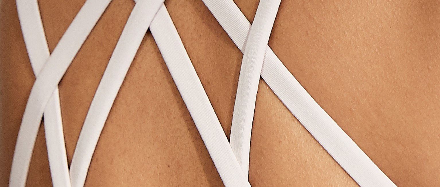 Back of white strappy sports bra