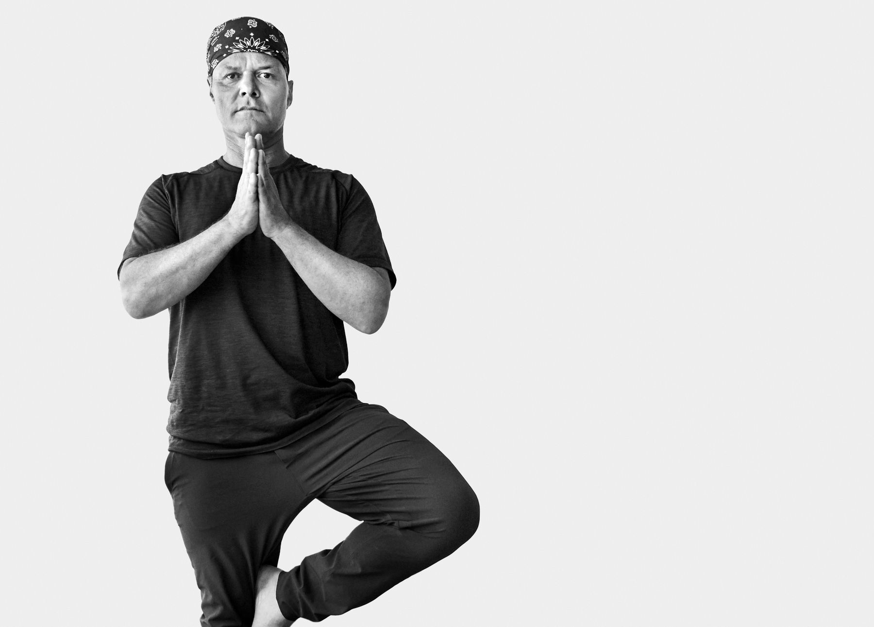 Global Yoga Ambassador Baron Baptiste in tree pose