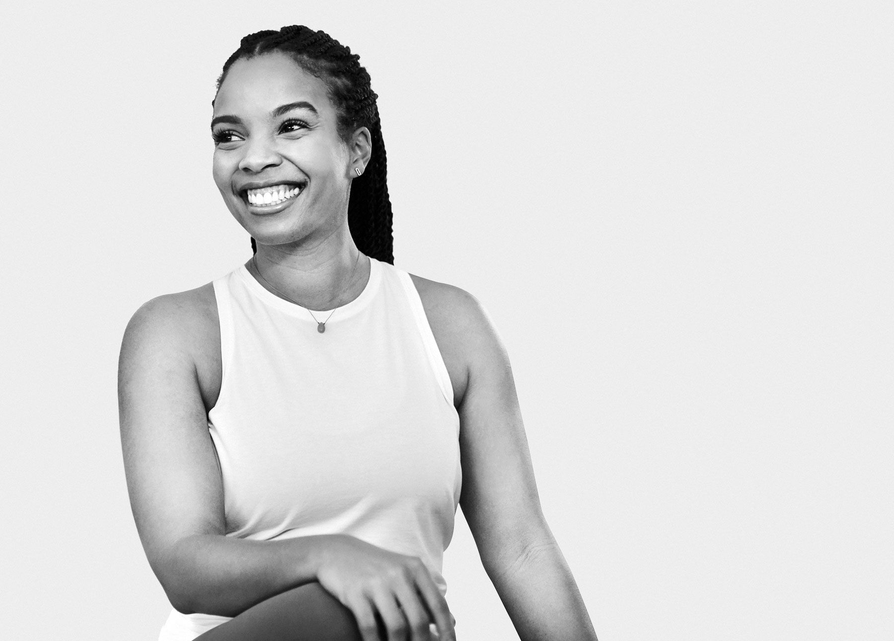 Chelsea Jackson Roberts in a seated yoga pose 