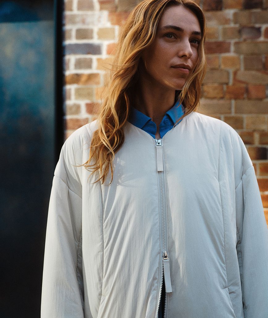 Woman wearing lululemon Thermozen Jacket