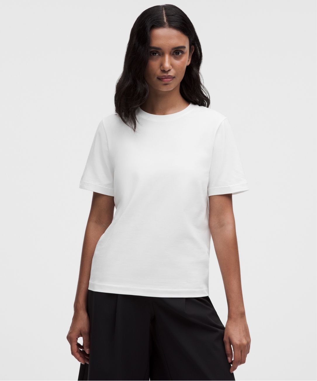 A person wears a classic-fit T-shirt from lululemon. 