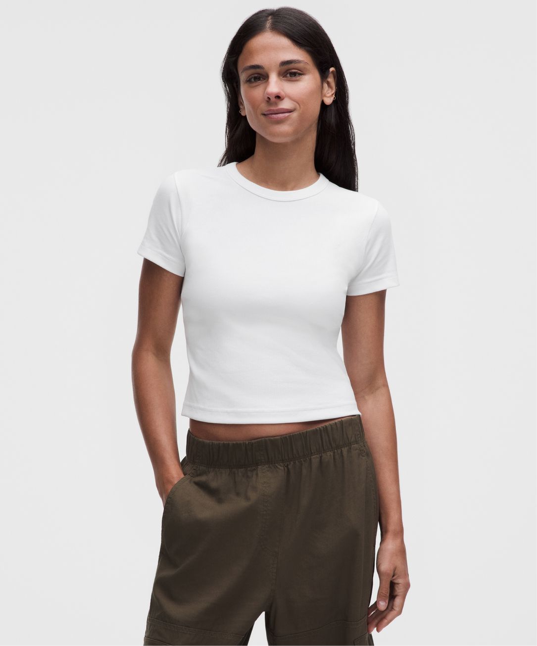 A person wears a tight-fit T-Shirt from lululemon. 