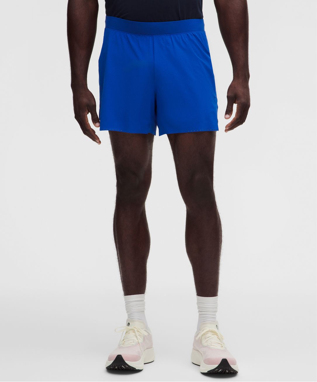 A person wears Fast and Free Shorts from lululemon.