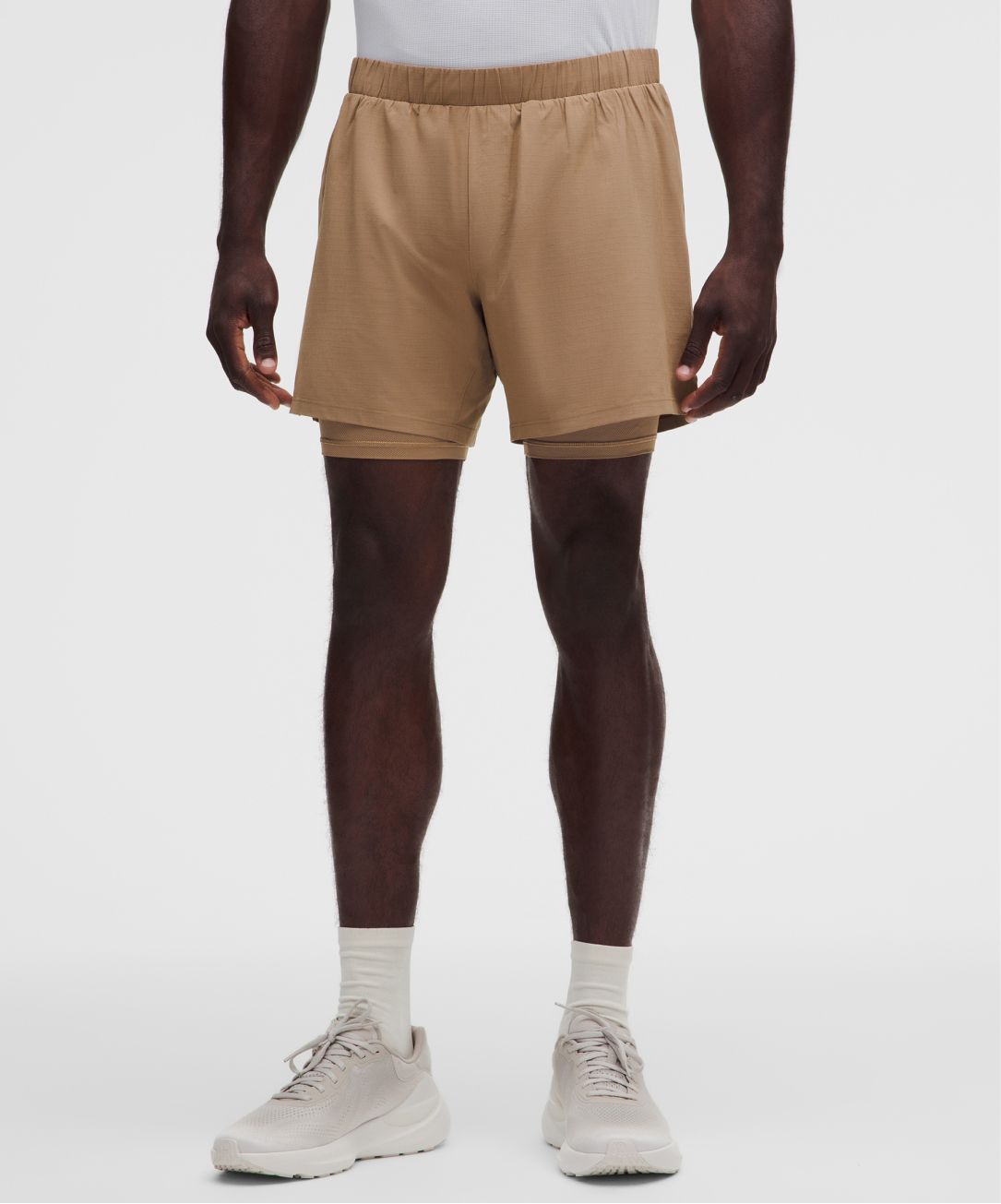A person wears Mile Maker Shorts from lululemon.