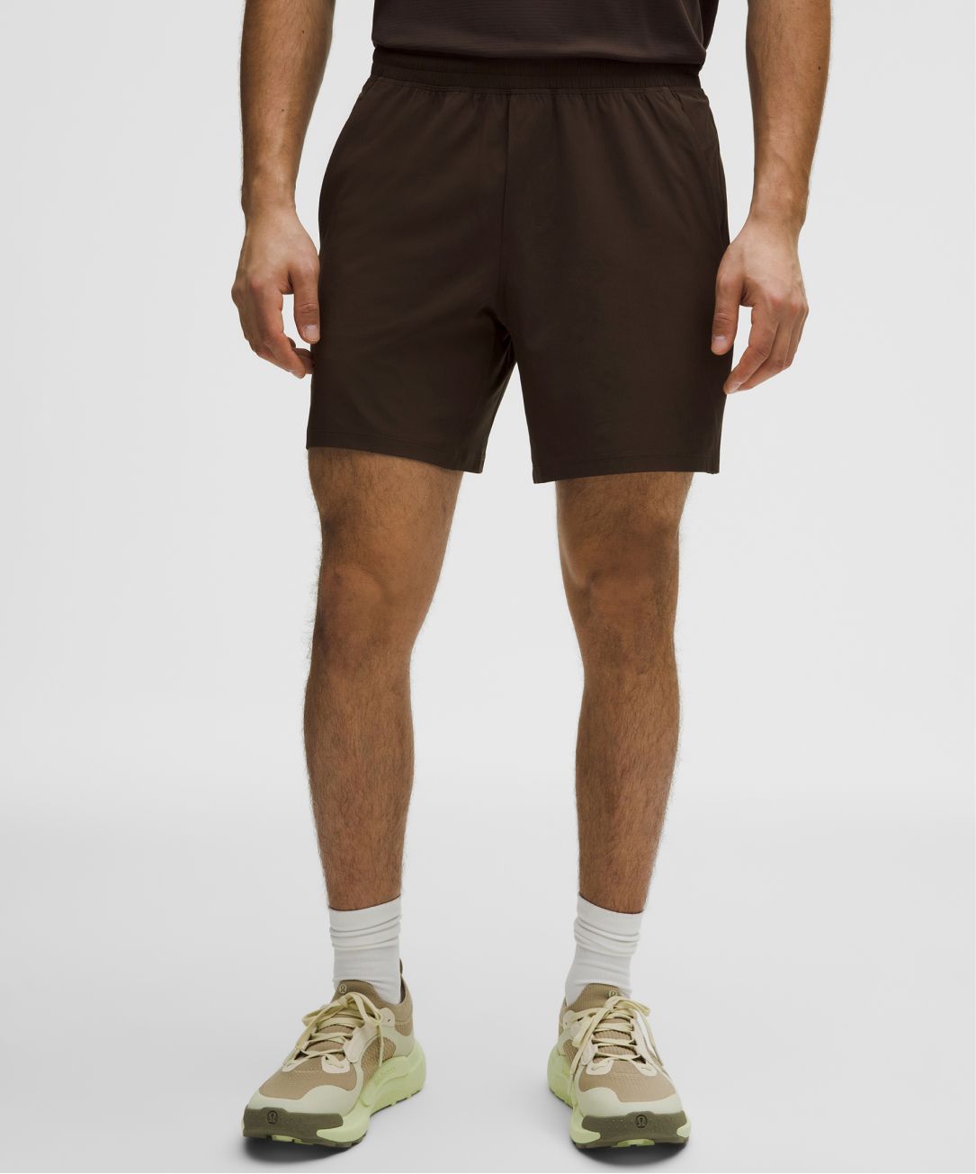 A person wears Pace Breaker Shorts from lululemon.
