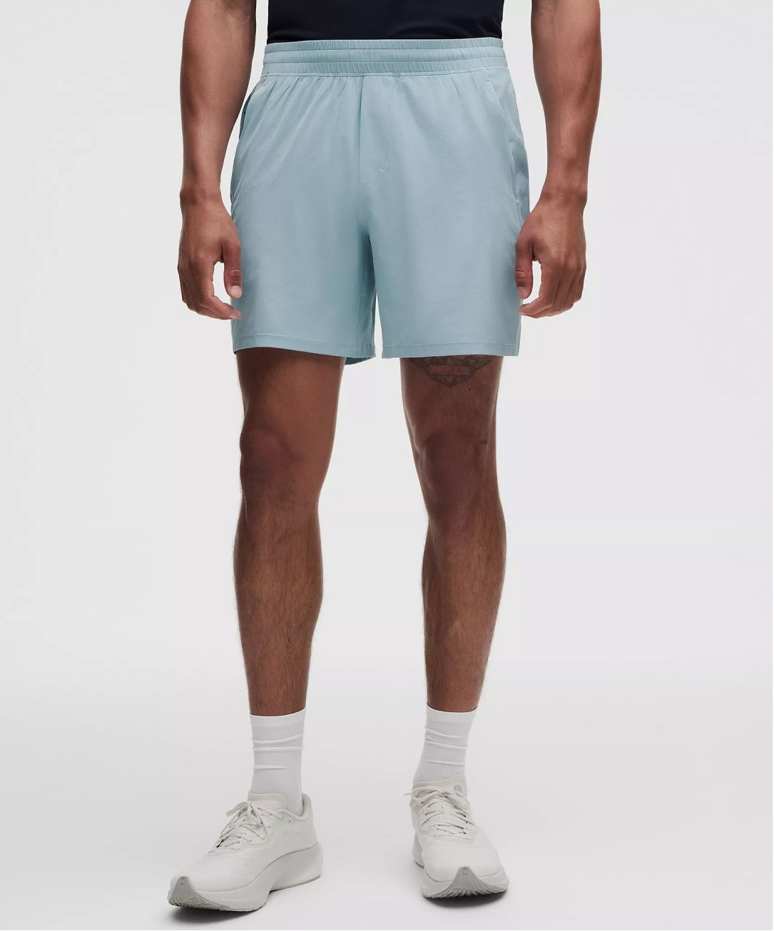 A person wears Pace Breaker Shorts from lululemon.