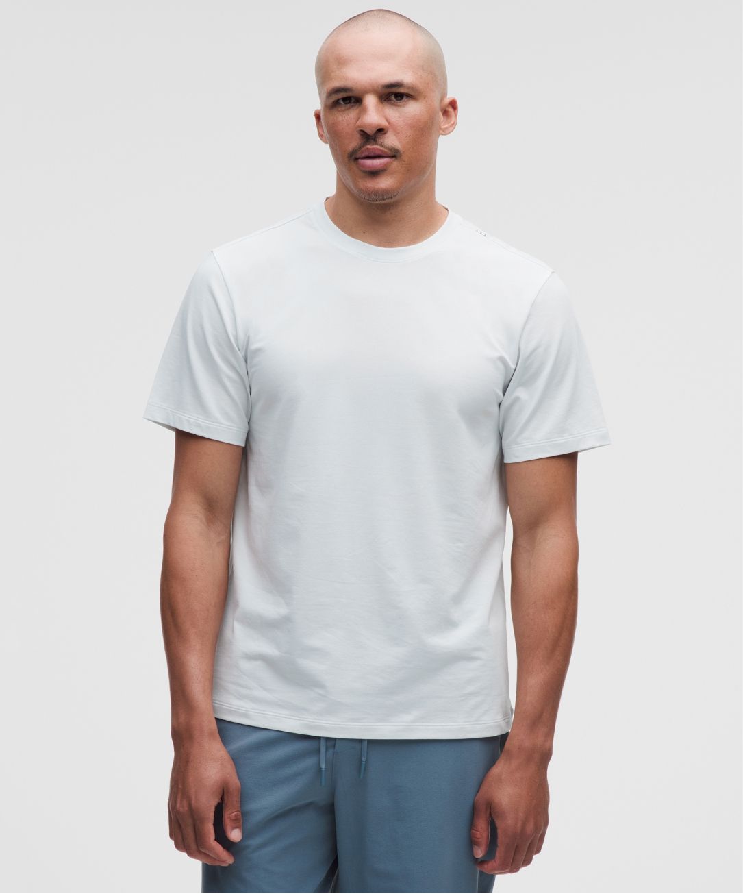 A person wears a Zeroed In Short-Sleeve Shirt from lululemon.