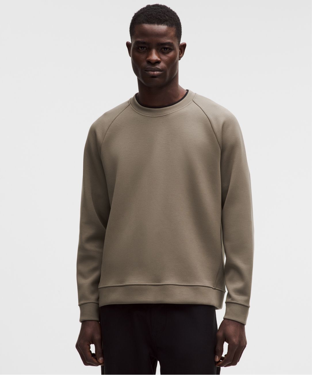 A person wears the Smooth Spacer Crew from lululemon.