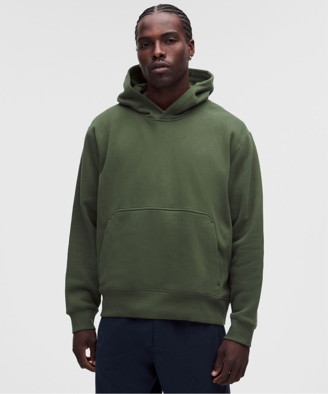 A person wears the Steady State SuperLoft Hoodie from lululemon.