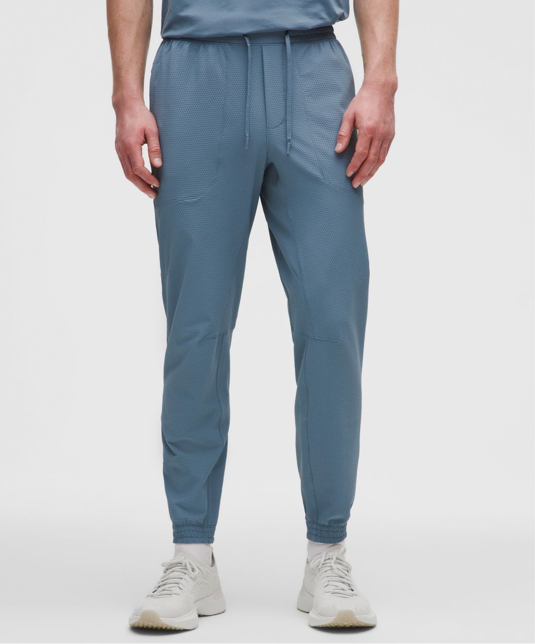 A person wears the License to Train Textured Jogger from lululemon.