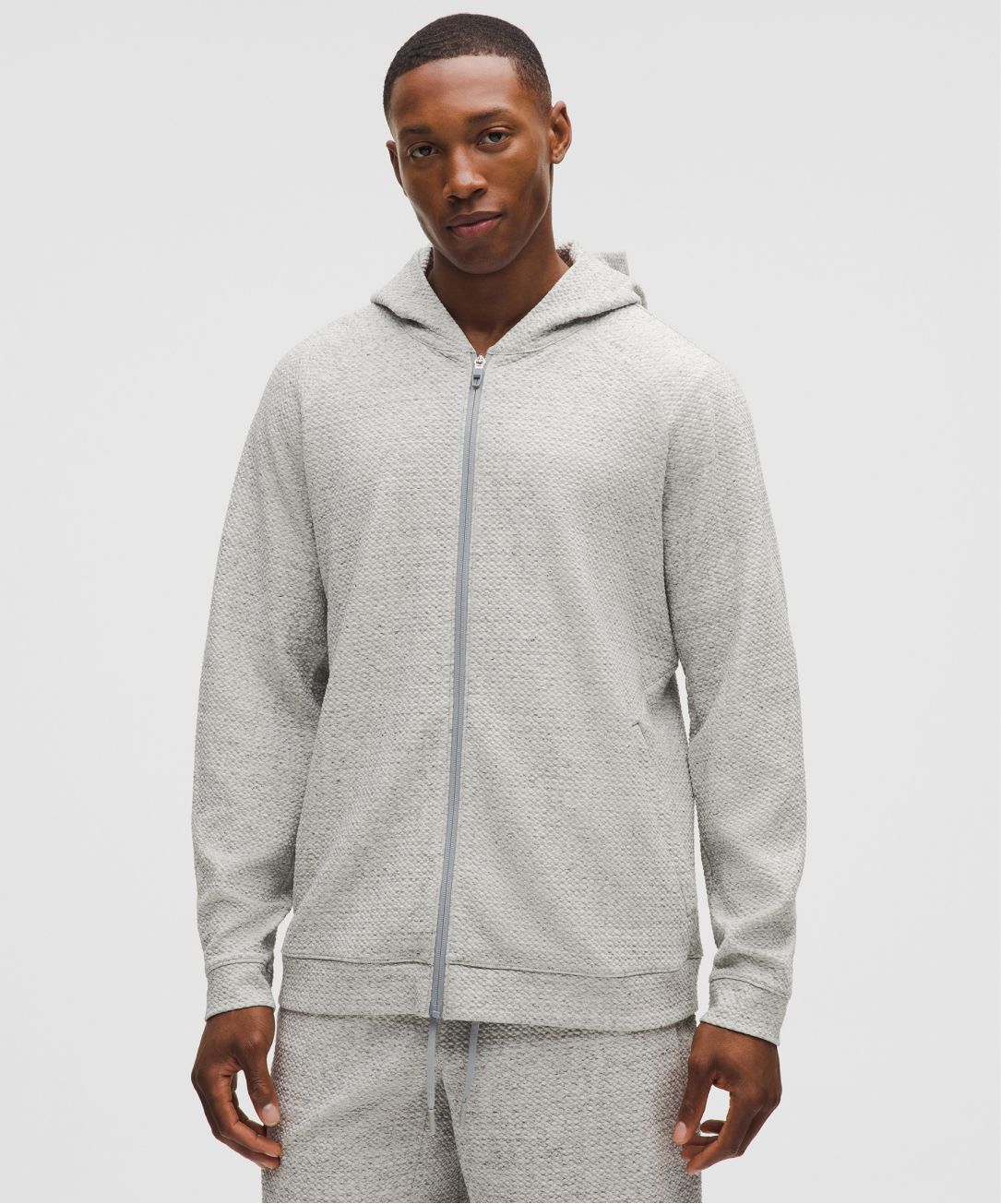 A person wears the Ease the Day Full-Zip Hoodie from lululemon.