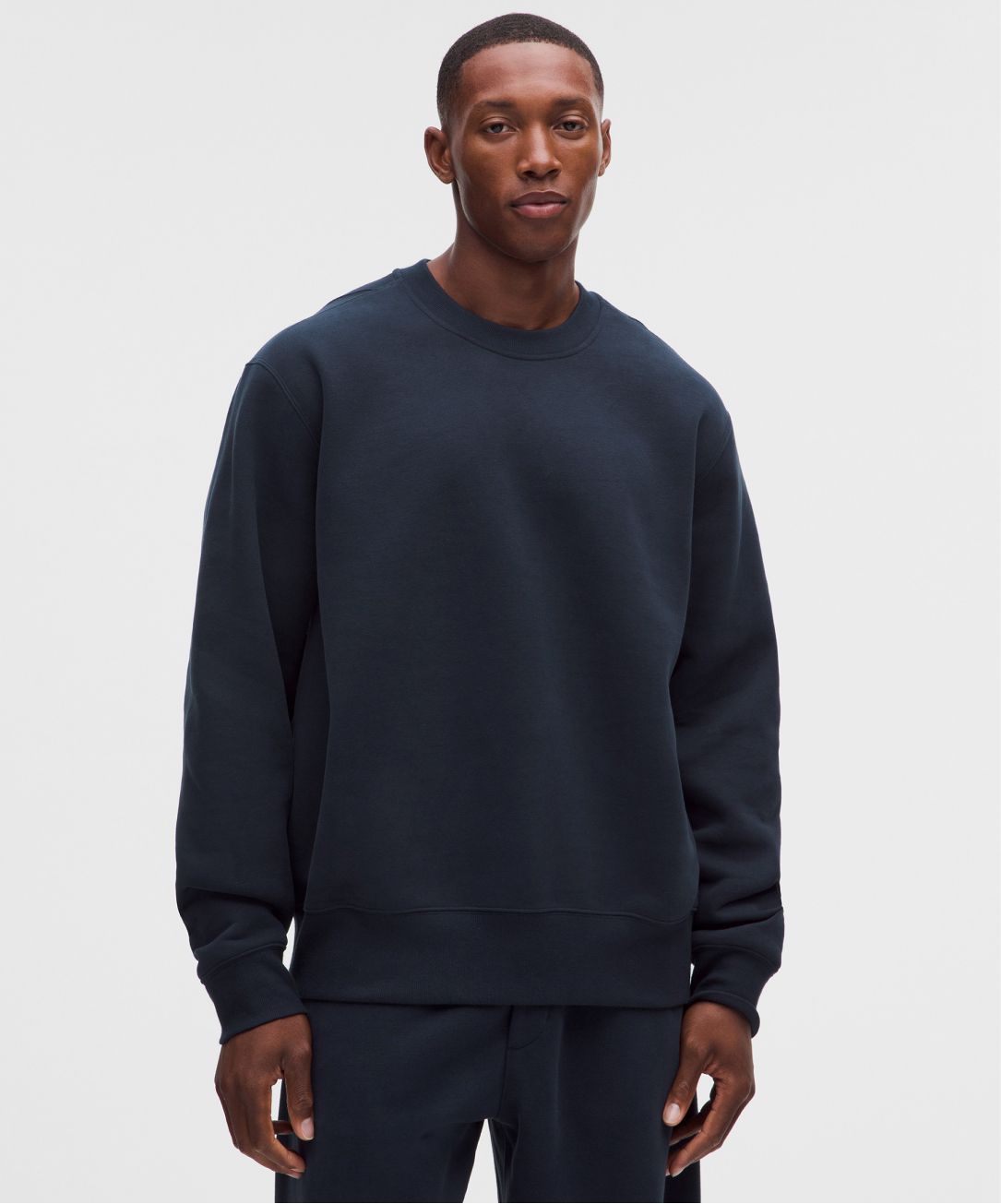 A person wears the Steady State SuperLoft Crew from lululemon.