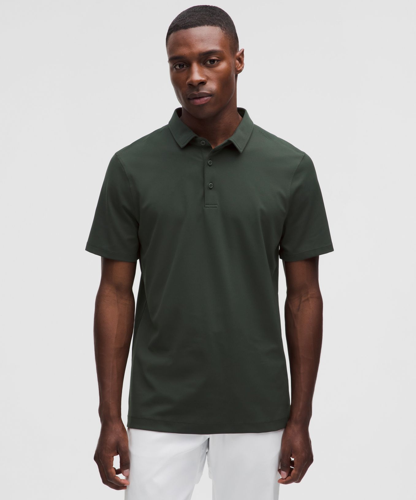 A person wears a Men's ShowZero Slim-Fit Polo Shirt from lululemon. 
