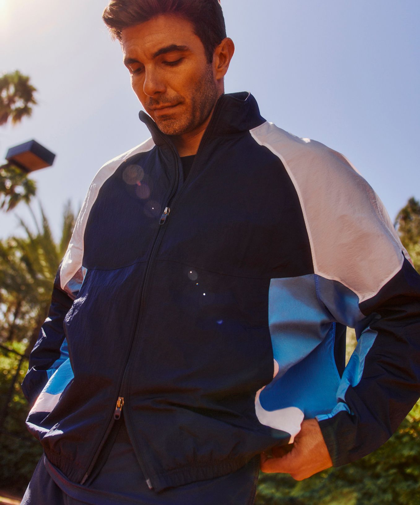 Tennis Prodigy and AARMY Founder Akin Akman wears the Nylon Oversized Track Jacket.