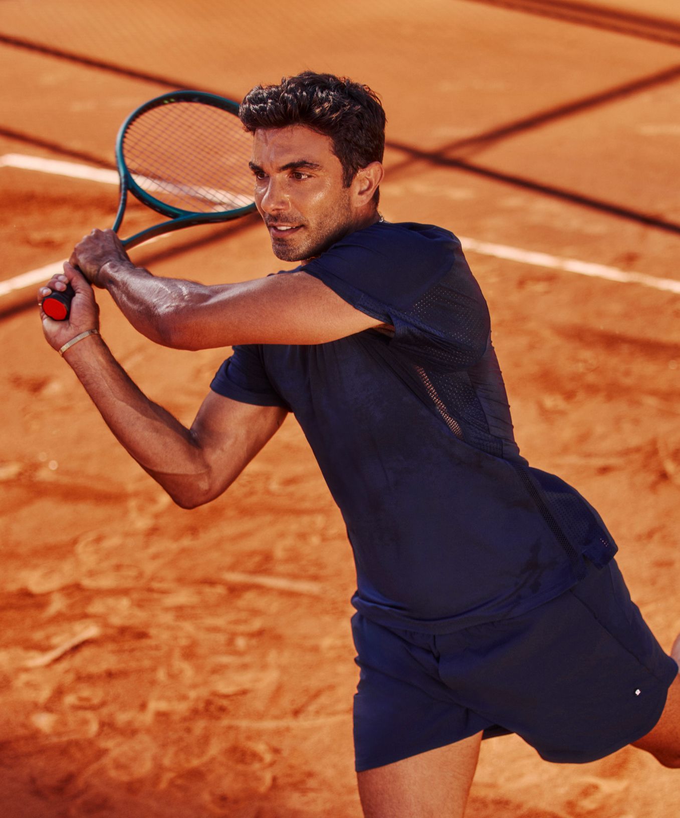 Tennis Prodigy and AARMY Founder Akin Akman plays in new Mesh-Panelled Tennis Shirt.