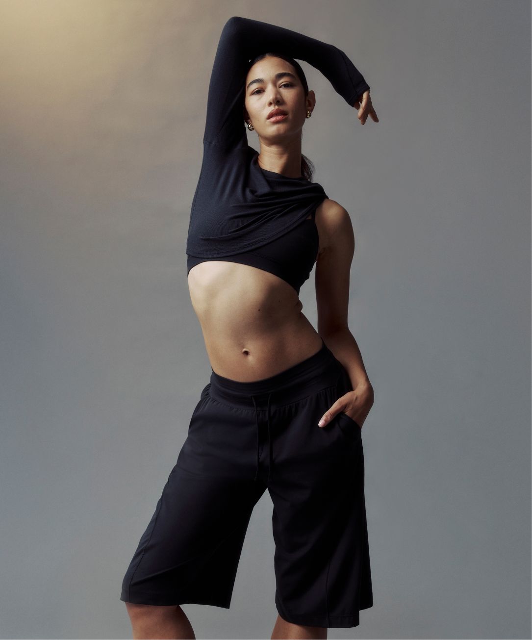 A person wears the lululemon Groove Bermuda Short.