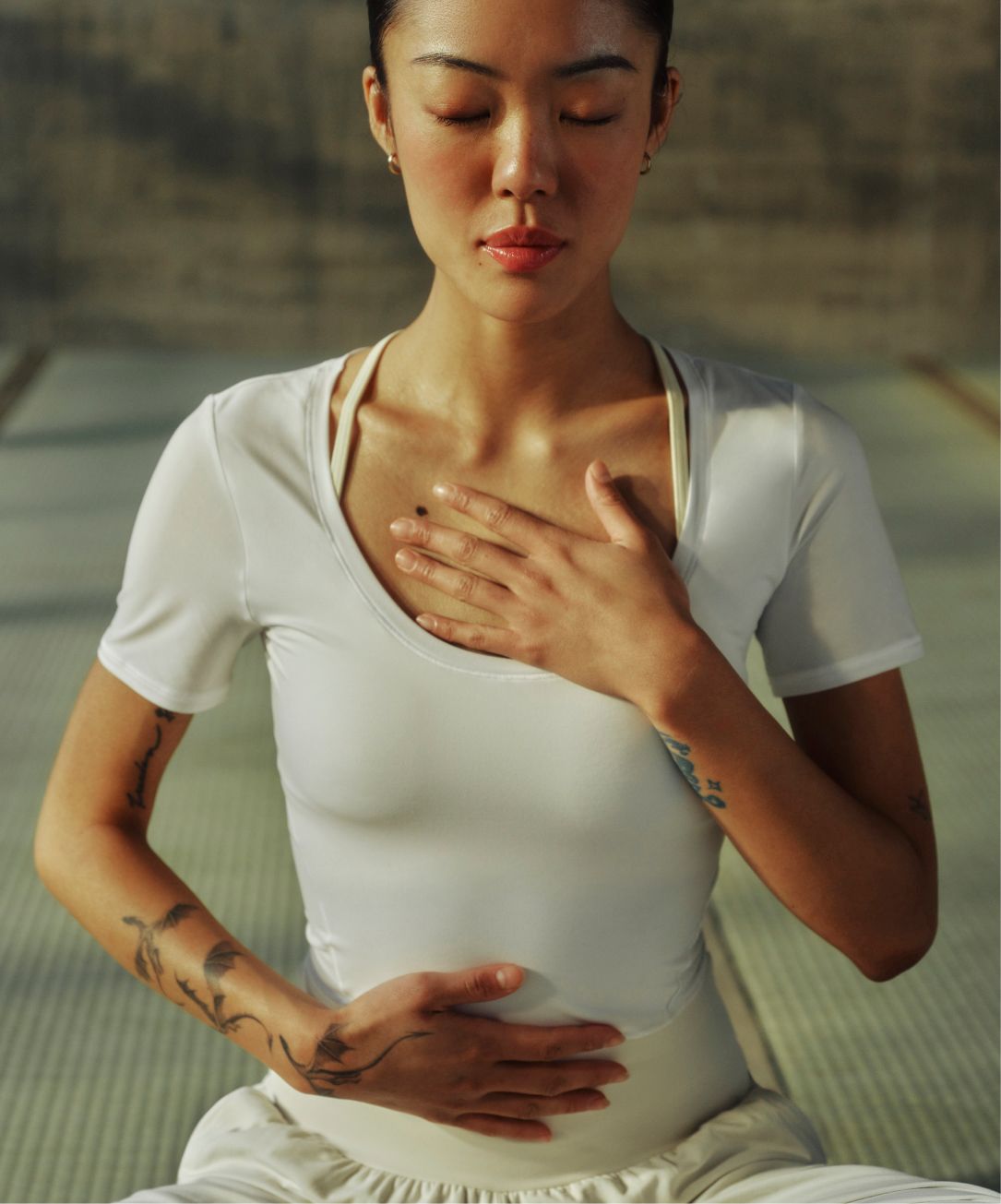 A person wears the Nulu™ Scoop-Neck Tee from lululemon.