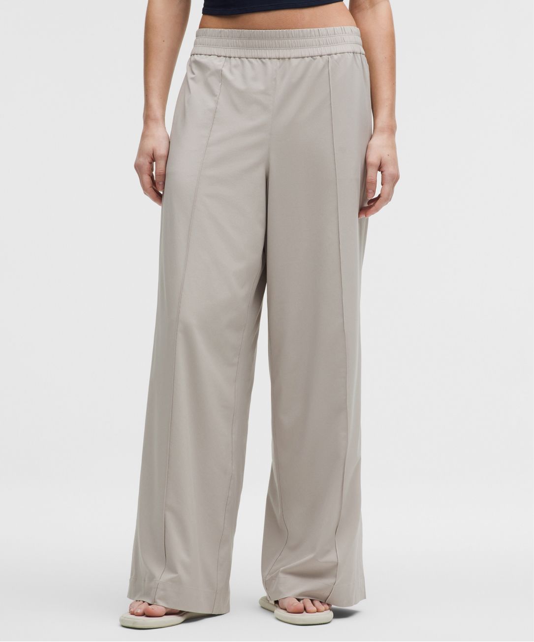 A person wears a Breezily pant from lululemon.