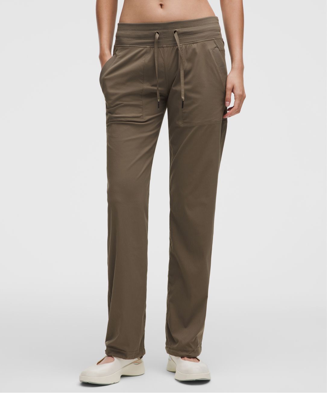 A person wears a Dance Studio pant from lululemon.
