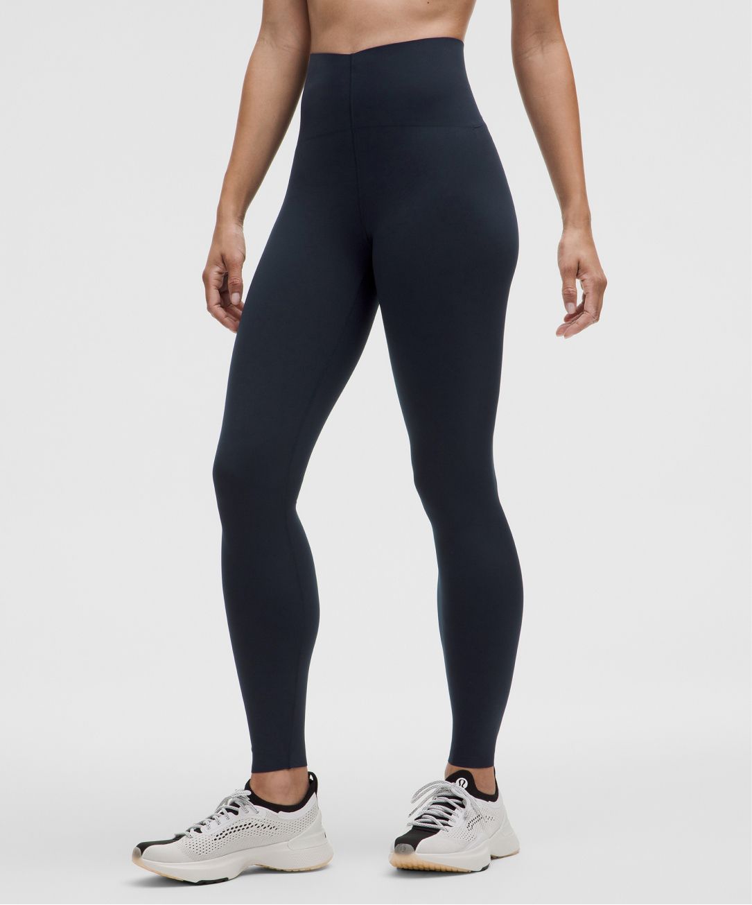 A person wears Glow Up tights from lululemon.