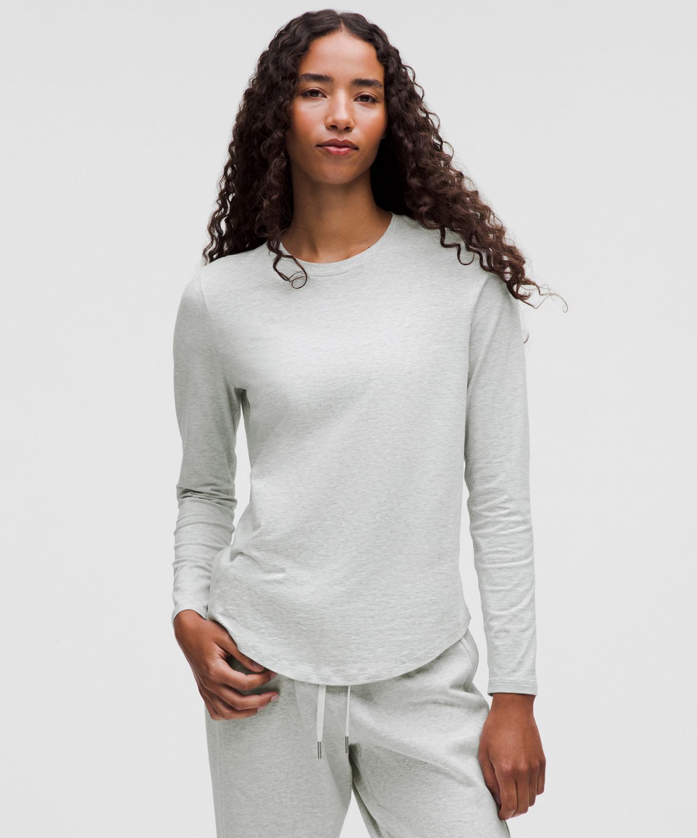 A person wears a matching lounge set from lululemon.