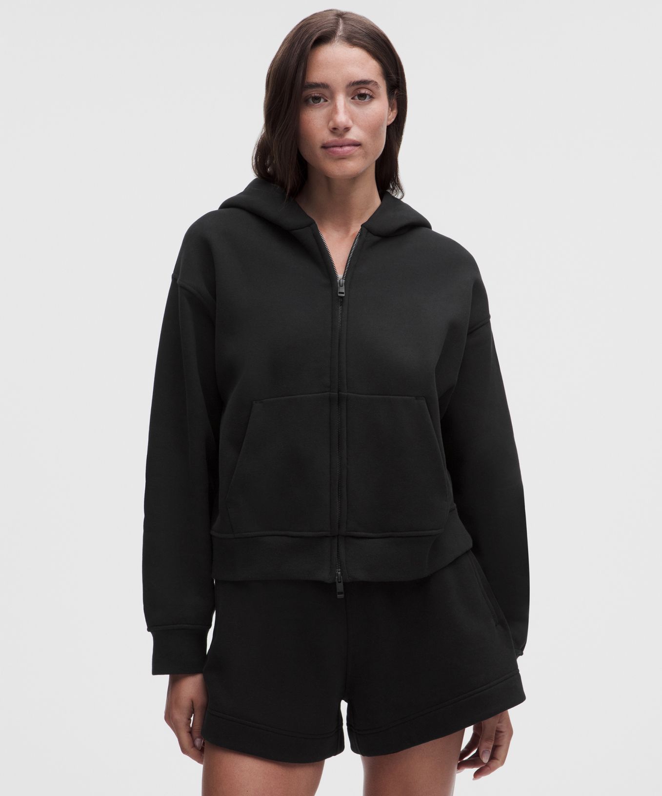 A person wears a matching sweat set from lululemon.