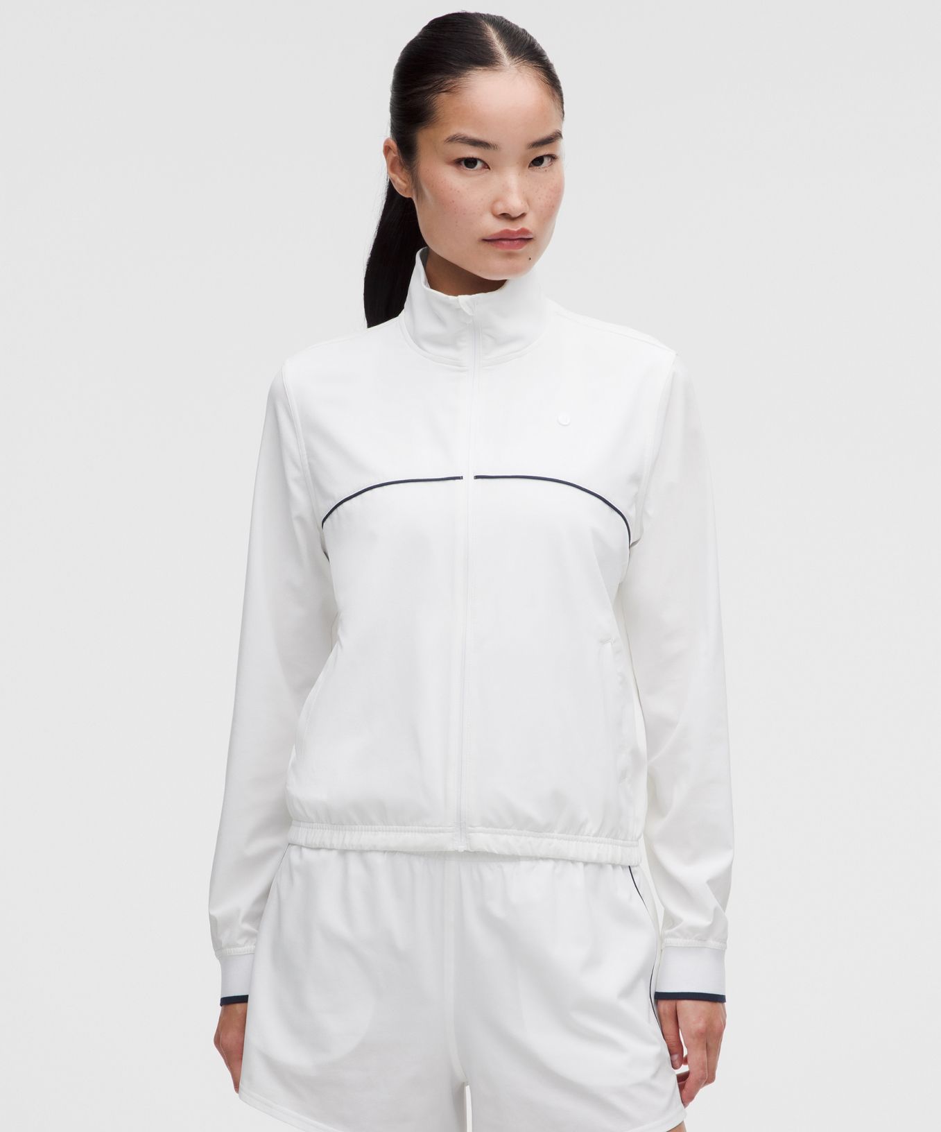 A person wears a matching tracksuit from lululemon.
