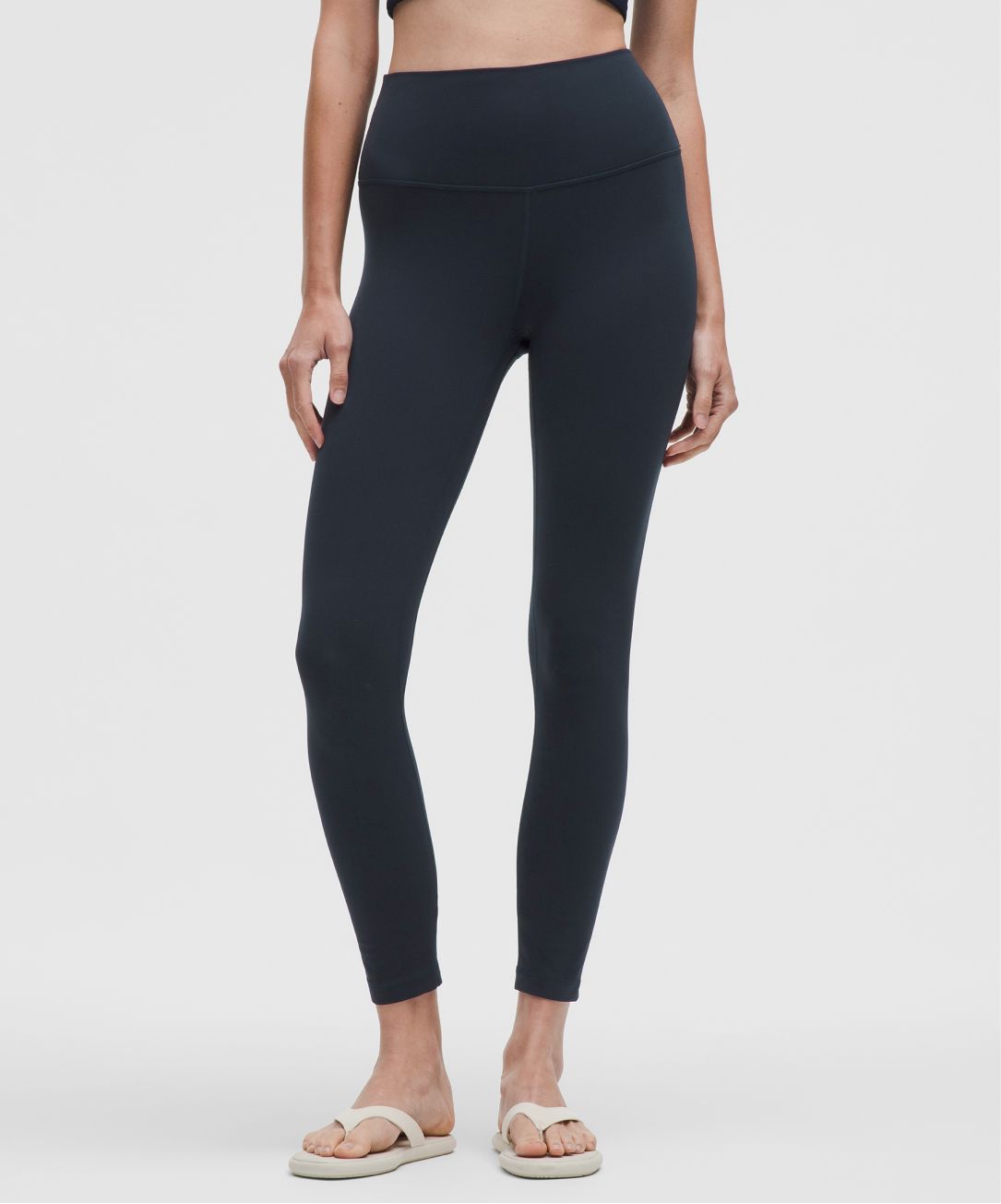 A person wears an Align pant from lululemon.