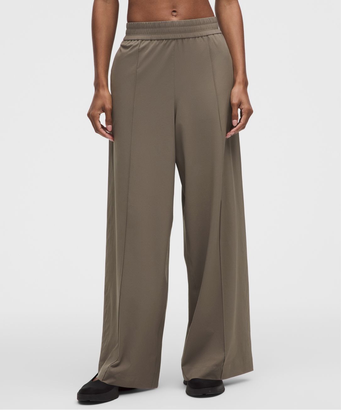 A person wears a Breezily pant from lululemon.
