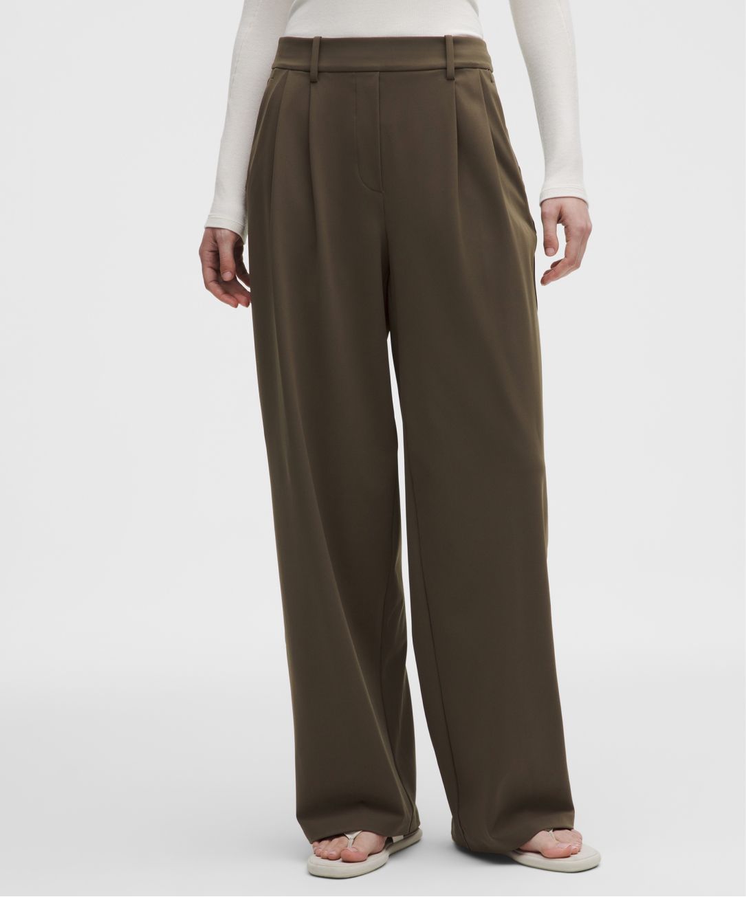 A person wears a DayDrift pant from lululemon. 