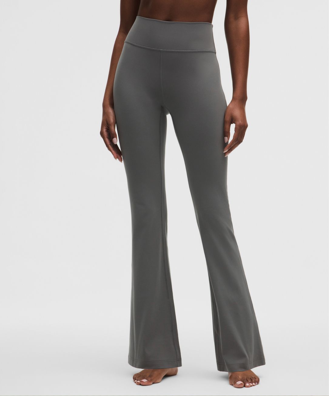 A person wears a Groove pant from lululemon.