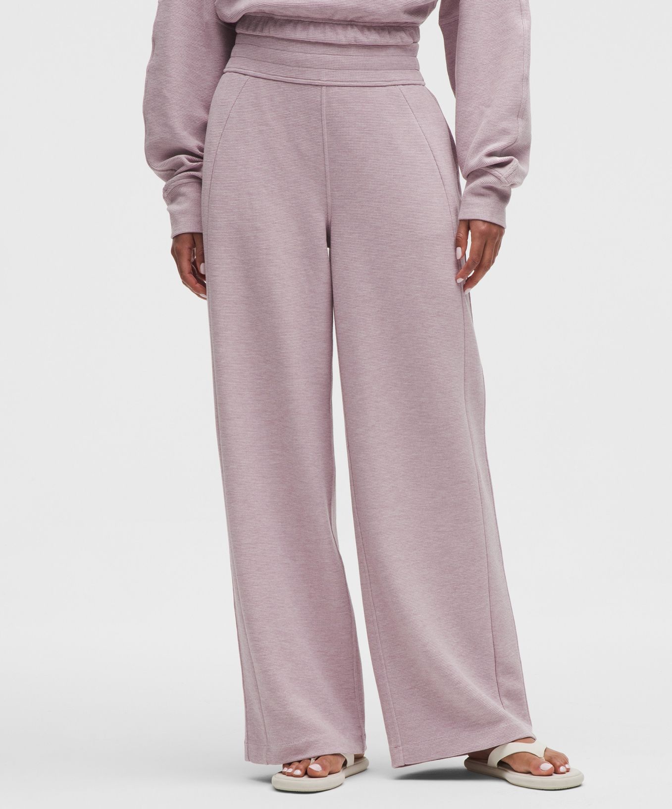 A person wears Scuba pants from lululemon. 