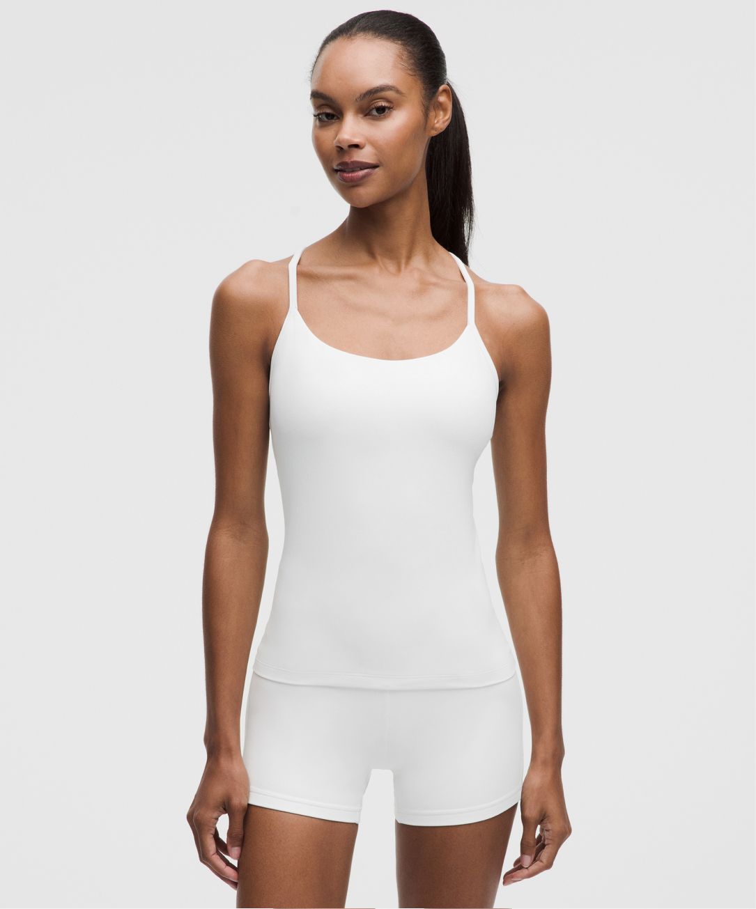 A person wears a Flow Y tank top from lululemon. 
