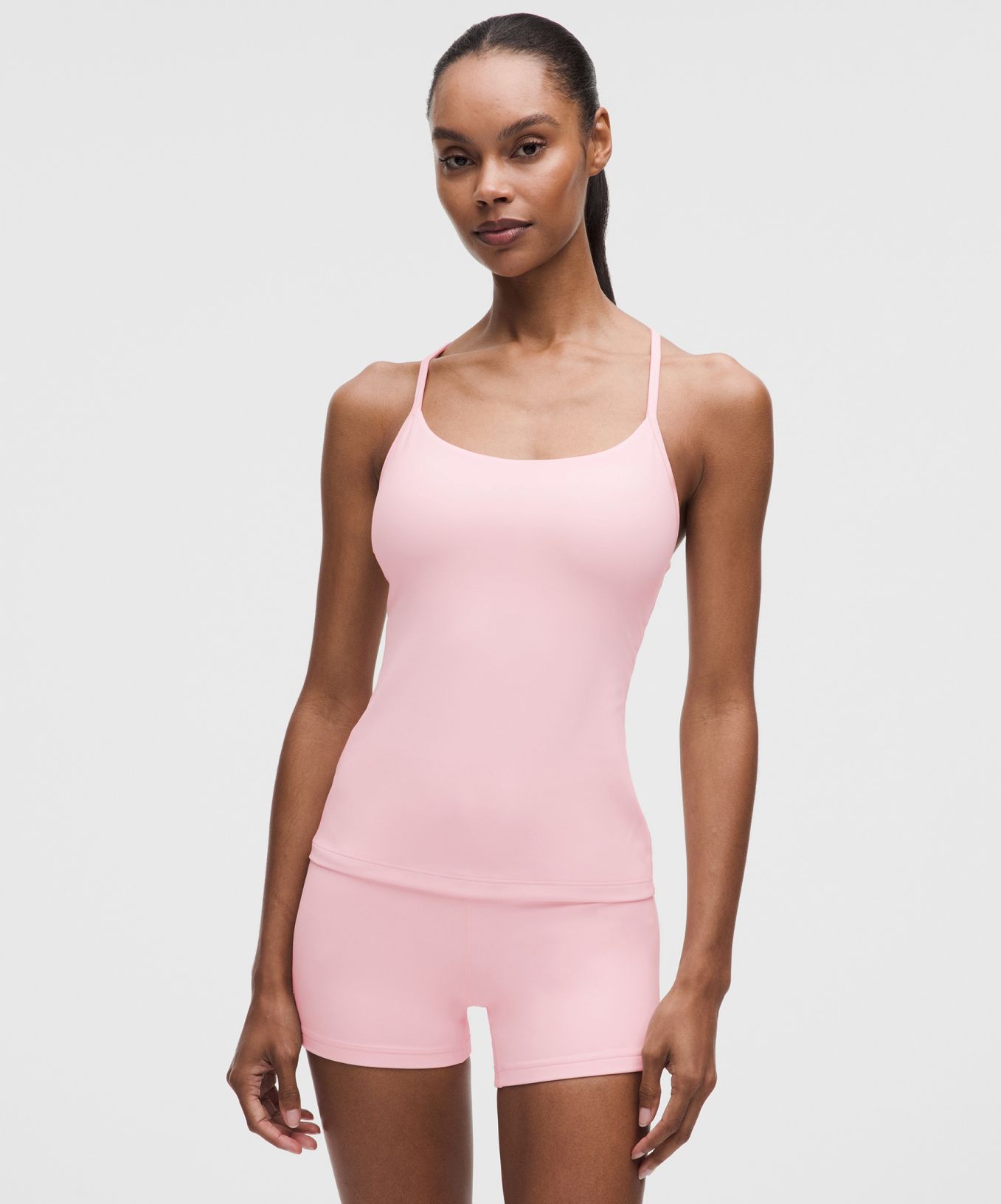 A person wears matching sets for travel from lululemon.