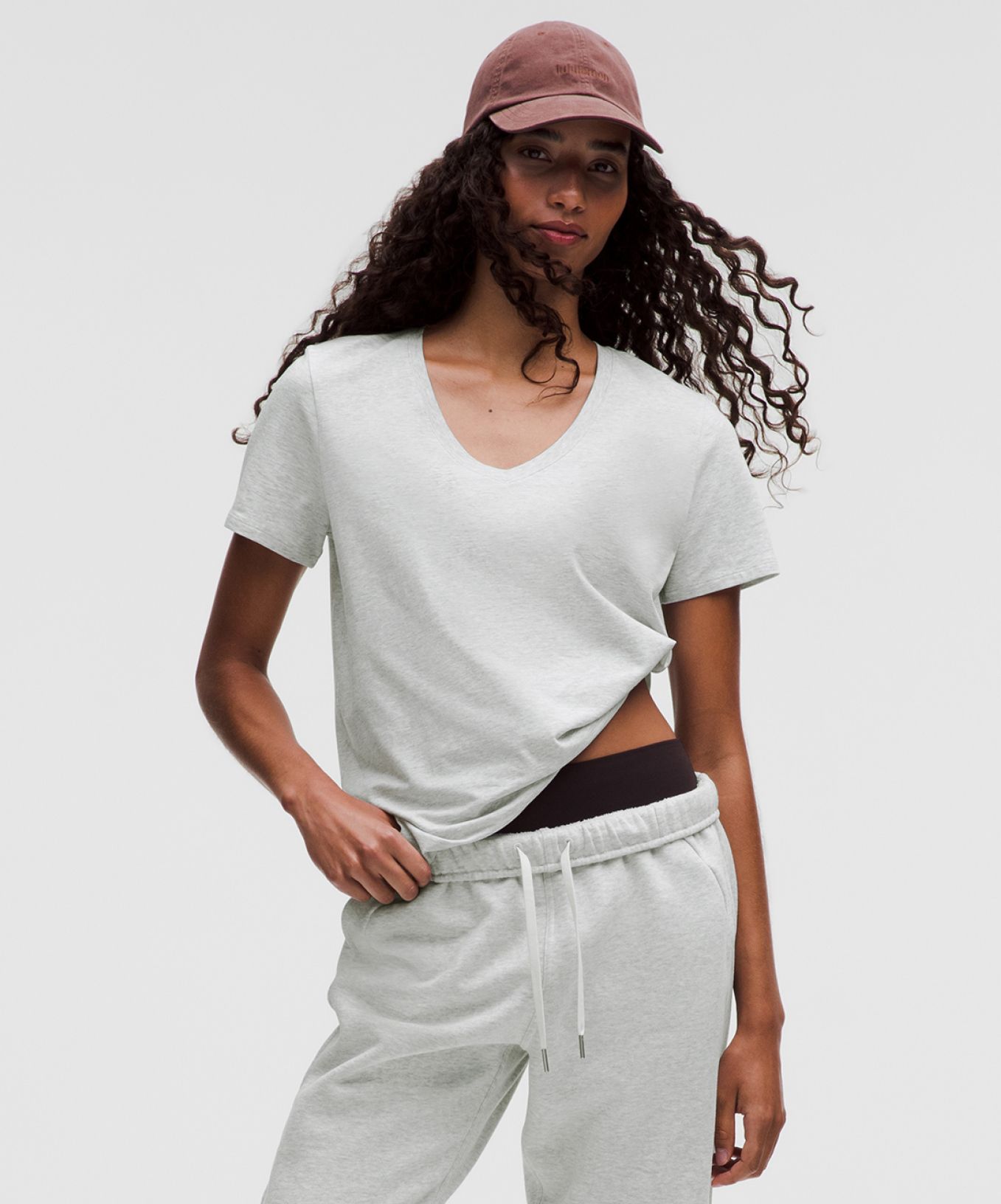 A person wears warm weather travel clothes from lululemon.