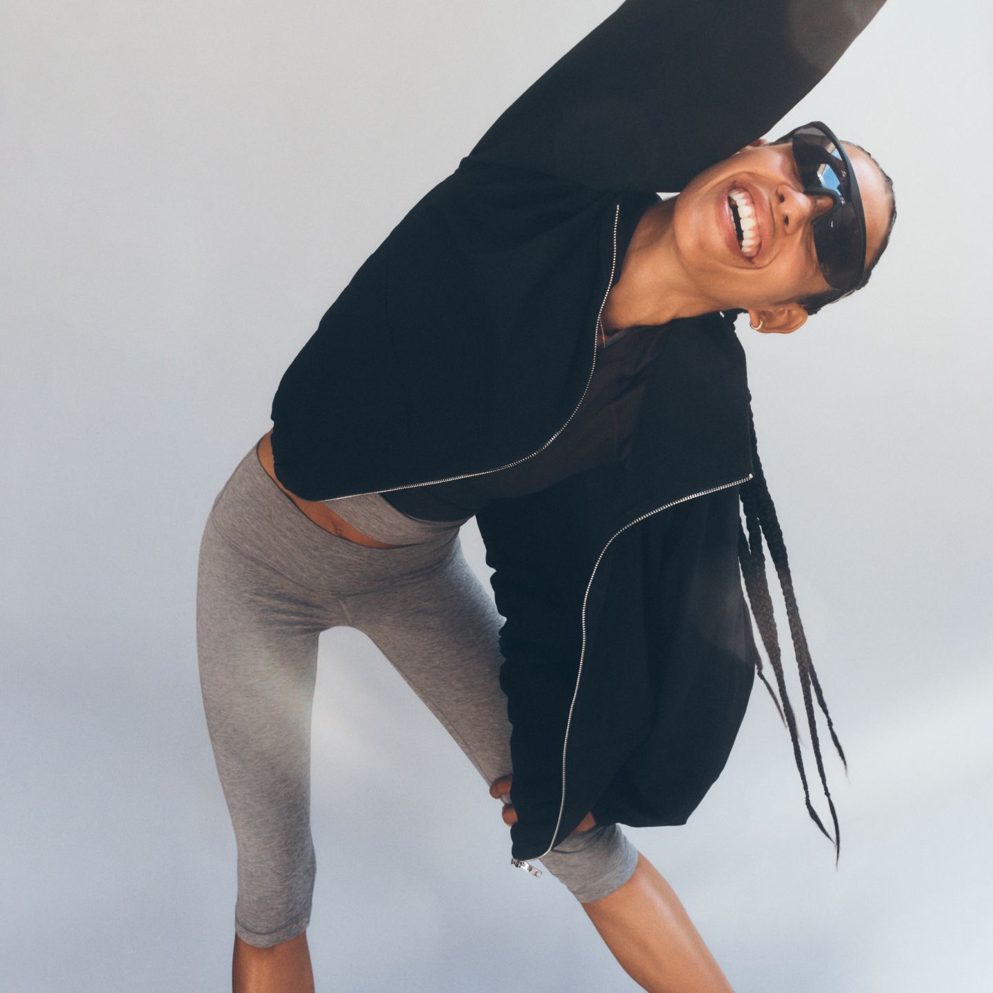 A mom stretching in the Align High-Rise Crop.