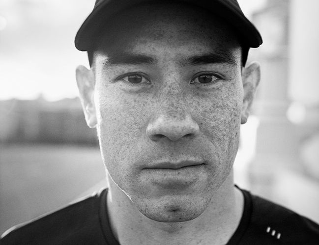 Man wearing a hat looking directly at the camera.