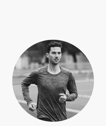 Man running on an outdoor track.